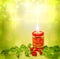 Christmas candle and holly background