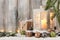 Christmas candle lantern, gift boxes and decoration on snow