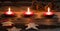 Christmas candlelight background with ginger bread decorations on old wood