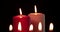 Christmas candles with bright light on dark