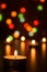 Christmas candles burning at night. Abstract candles background. Golden light of candle flame. Hope, fire.