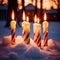 Christmas candles burning outdoors in the snow, traditional seasonal cultural festivities