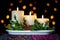 Christmas candles decoration with holly and berries.
