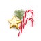 Christmas candy, gold star and green fir branch on white background