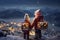 Christmas card. back view of Little kids with gift box on the top of snowy hills looking on the town