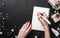 Christmas card background - Woman hands with red nails writing letter with wooden pencil.