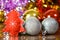 Christmas card on bright bokeh background. A red felt herringbone and Christmas decorations against a background of blurry defocus