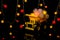 Christmas card. Children`s car carries bright festive garlands. Dark background, yellow color. Happy Chrismas Concept