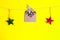 Christmas card concept. Craft envelope with felt christmas trees figures pined by decorative snowflake and glistening stars decor