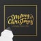 Christmas card design with gold lettering and foil frame. Festive postcard for winter holidays. Background of black premium paper