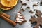 Christmas card. Homemade gingerbread in the form of Christmas trees, drenched with white glaze. Cinnamon sticks and dried orange s