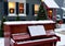 Christmas Carols Being Sung Around A Neighborhood Piano, In A Snowy Street. Generative AI