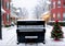 Christmas Carols Being Sung Around A Neighborhood Piano, In A Snowy Street. Generative AI