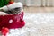 Christmas cat wearing Santa Claus hat sleeping on plaid under christmas tree with blurry festive decor. Adorable little tabby