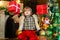 Christmas Celebration holiday. Christmas decorations. Models child having fun with gift. Cute little child near