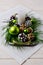 Christmas centerpiece with snowy pine cones on the serving tray