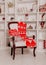 Christmas chair for Santa Claus with a red plaid and pillows on the background of a cozy New Year`s interior in a loft style