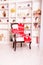 Christmas chair for Santa Claus with a red plaid and pillows on the background of a cozy New Year`s interior in a loft style