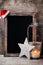 Christmas chalkboard with decoration. Santa hat, stars, Wooden