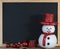 Christmas chalkboard decoration with snowman and red gift box