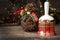 Christmas checkered bell on wooden table against background Christmas garland