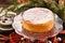 Christmas cheese cake on wooden background