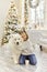 Christmas Child girl hug dog Samoyed. Christmas, winter and people concept