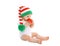 Christmas and childhood concept - baby in bright knitted gnome