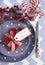 Christmas children family party table place settings in purple, red and white