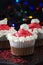 Christmas chocolate cupcakes pink buttercream. Blur light and dark background. Selective focus