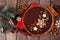 Christmas chocolate gingerbread tart. Above view table scene over rustic wood.