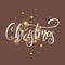 Christmas. Christmas script lettering and shiny gold Christmas stars confetti
