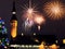 Christmas city market place in Tallinn town Hall Square fireworks , Illuminated tree,night light blurred ,people walking ,New year