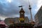 Christmas clock tower at Christmas fair on Alexanderplatz in Berlin. Rustic wooden decorations for New Year celebration. Cityscape