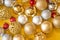 Christmas colored balls on yellow background