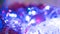 Christmas colorful New Year`s Bokeh neon lights. Abstract Blurred photo background with blinking lights from tangled garlands. Dec