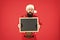 Christmas is coming. Hipster hold santa wish list blackboard. Bearded man with blank advertising blackboard. Blackboard