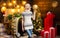 Christmas is coming. Home interior christmas tree decoration. Woman knitted sweater enjoy christmas atmosphere at home