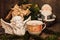 Christmas composition angel, cup of coffee, orange on a dark wooden table