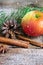 Christmas composition: Apple, spruce branch, cinnamon sticks