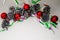 Christmas composition of balls, pine cones and garlands on a white background. Many pine cones and five red balls are