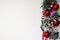 Christmas composition of balls, pine cones and garlands on a white background. Many pine cones and five red balls are