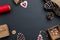 Christmas composition on black surface with red details on Christmas decorations