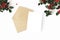 Christmas composition. Blank greeting card, envelope mock-up scene. Decorative banner. Holly berries and leaves berries