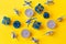 Christmas composition. Candles and Christmas decorations in blue on a yellow background.top view, copy space