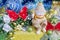 Christmas composition. Cheerful Snowman on gift and decorations.