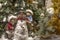 Christmas composition: children and a snowman in the forest. New Year`s decor.