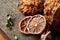 Christmas composition with chocolate biscuits, cinnamon and dried oranges on wooden background, close-up.