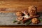 Christmas composition with chocolate biscuits, cinnamon and dried oranges on wooden background, close-up.