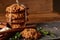 Christmas composition with chocolate biscuits, cinnamon and dried oranges on wooden background, close-up.